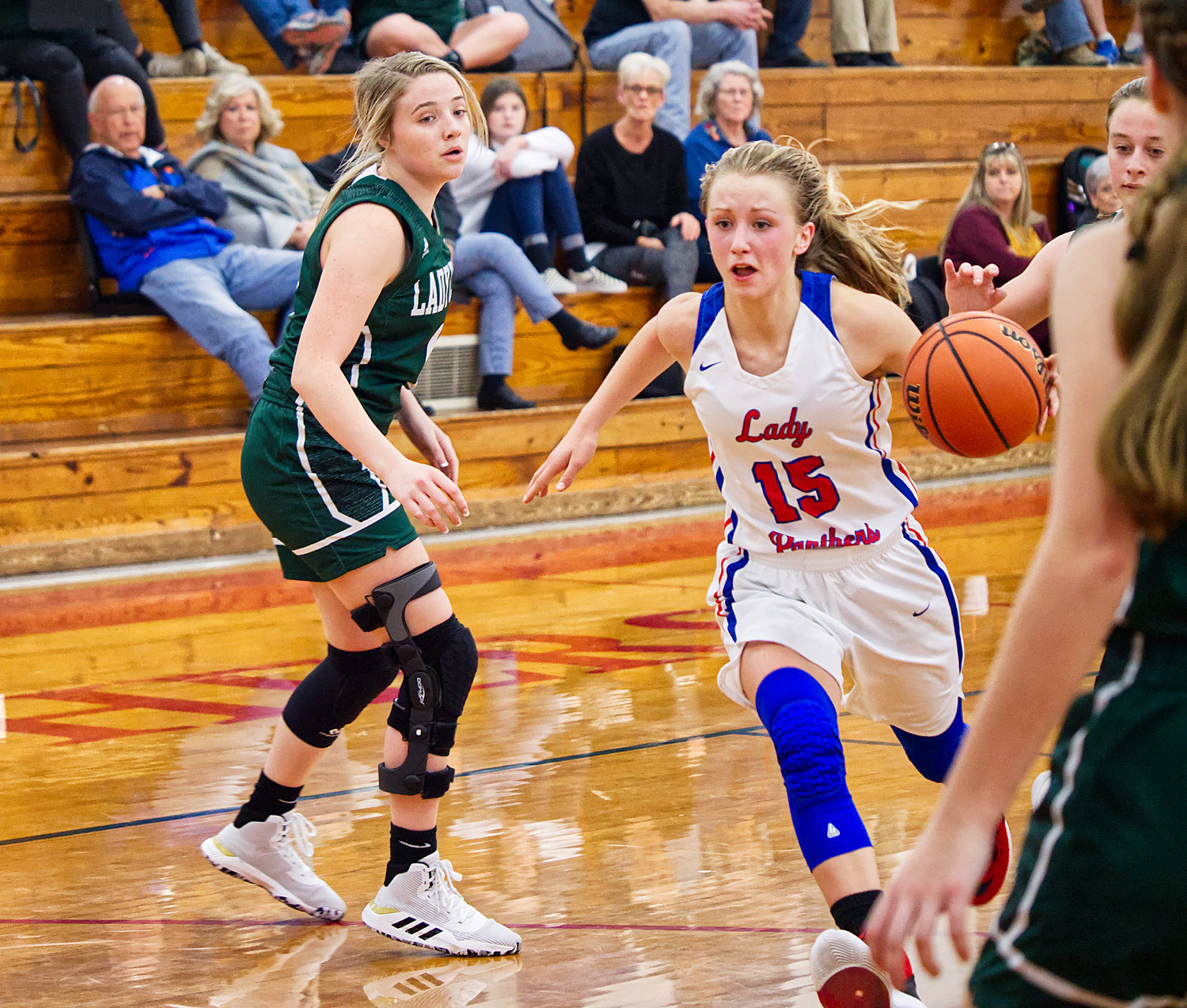 Bella Crawford (15) drives to the basket to score two of her fifteen points on the evening.